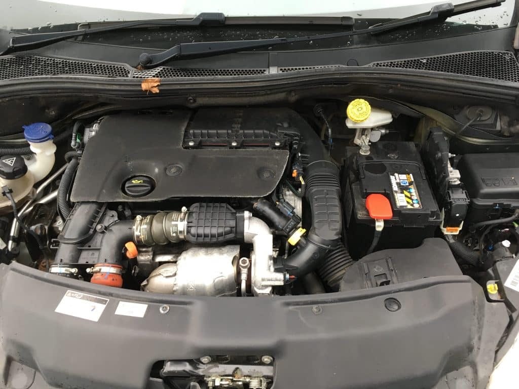 A picture of the engine compartment of a car.