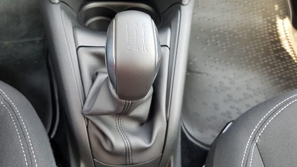 A close up of the gear shift in a car.