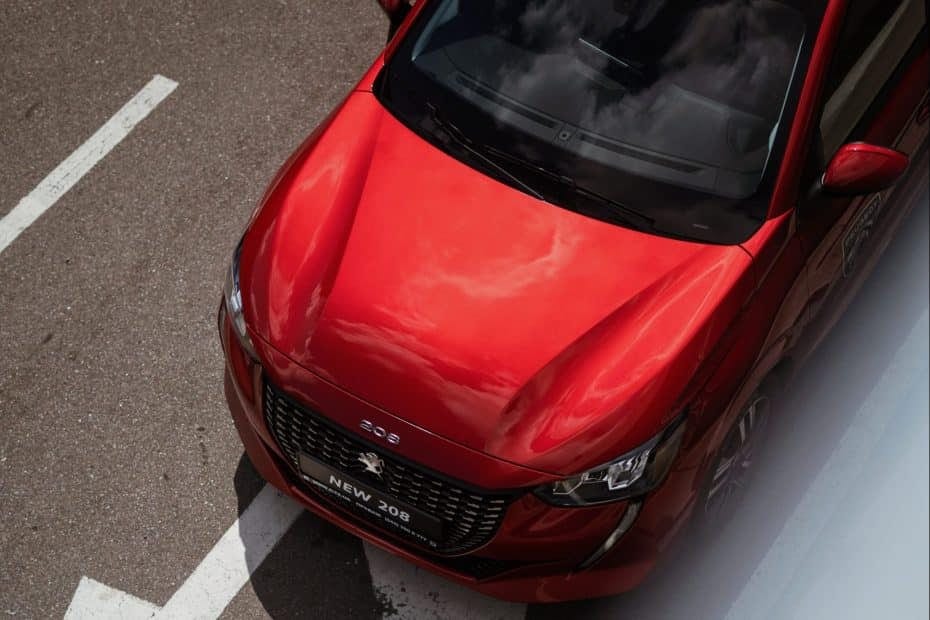 A red car is parked on a street.